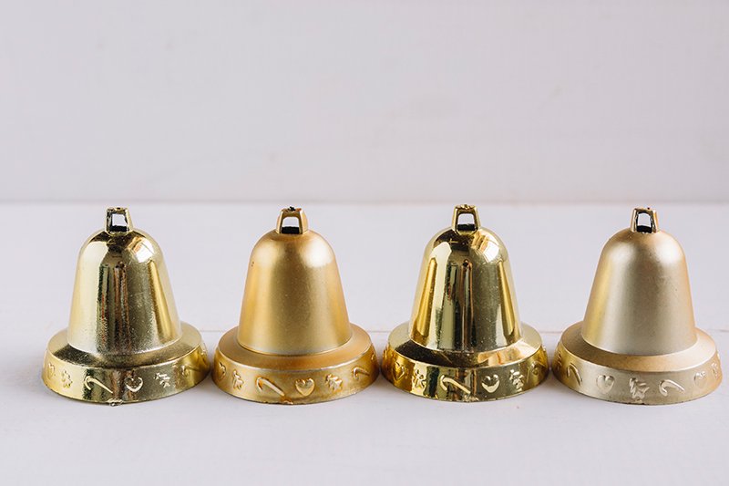 Four bells on table